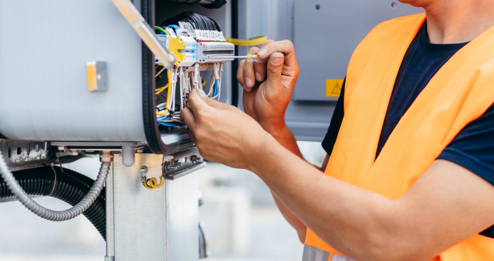hands-of-electrical-engineer-inspect-the-electrical-systems